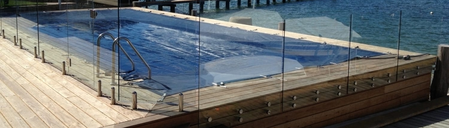 Fully frameless glass pool fence button fix at Avalon water front